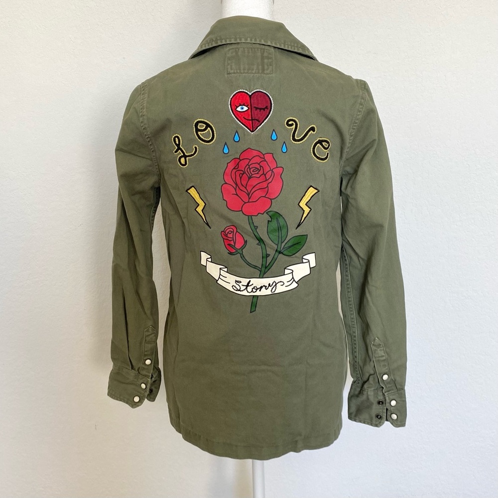 Olive green military jacket with embroidered rose and heart patches